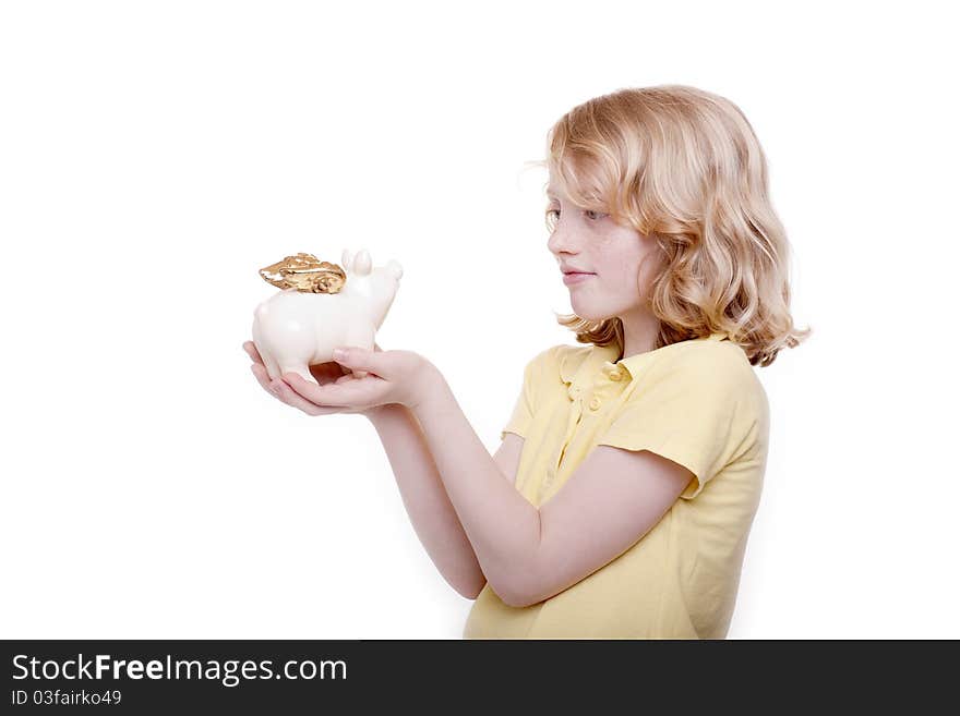 Small girl holds piggy bank in the hand. Small girl holds piggy bank in the hand