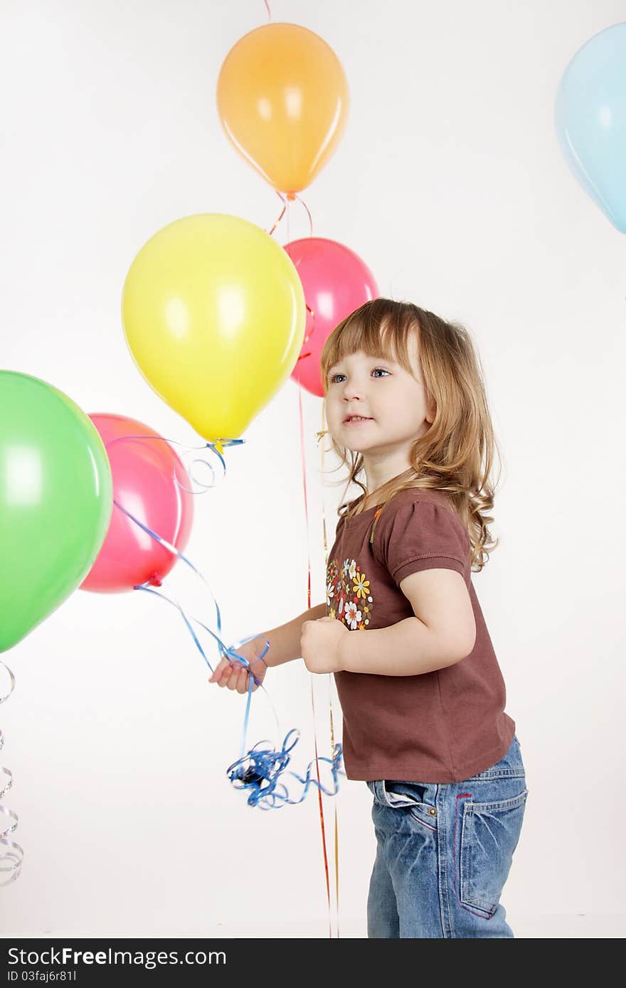 Young girl with colorful balloons