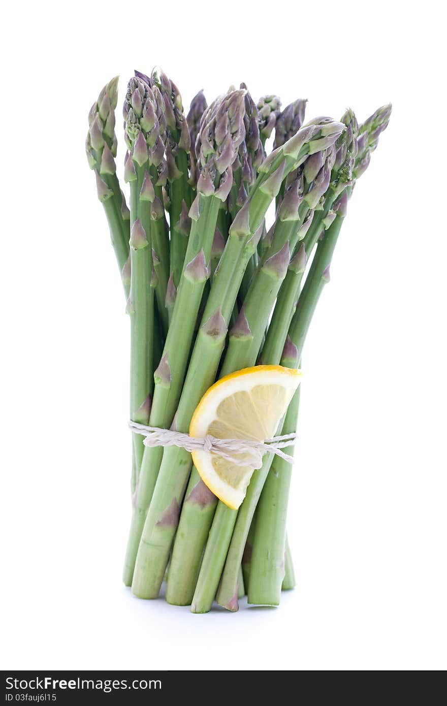 Green asparagus with lemon cutout