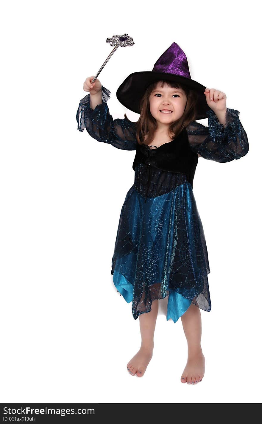 Cute little girl in witch costume making a face. isolated on white. Cute little girl in witch costume making a face. isolated on white