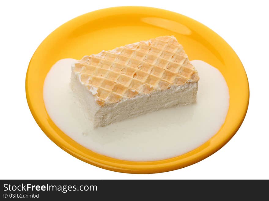 Melting ice cream in a yellow plate isolated on white background