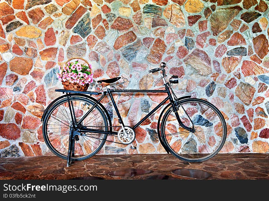 Vintage bicycle with basket of pink flowers. Vintage bicycle with basket of pink flowers