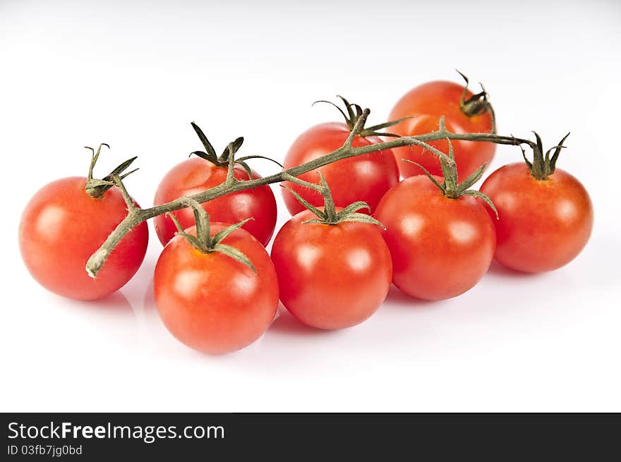 Red tomatoes on a white background