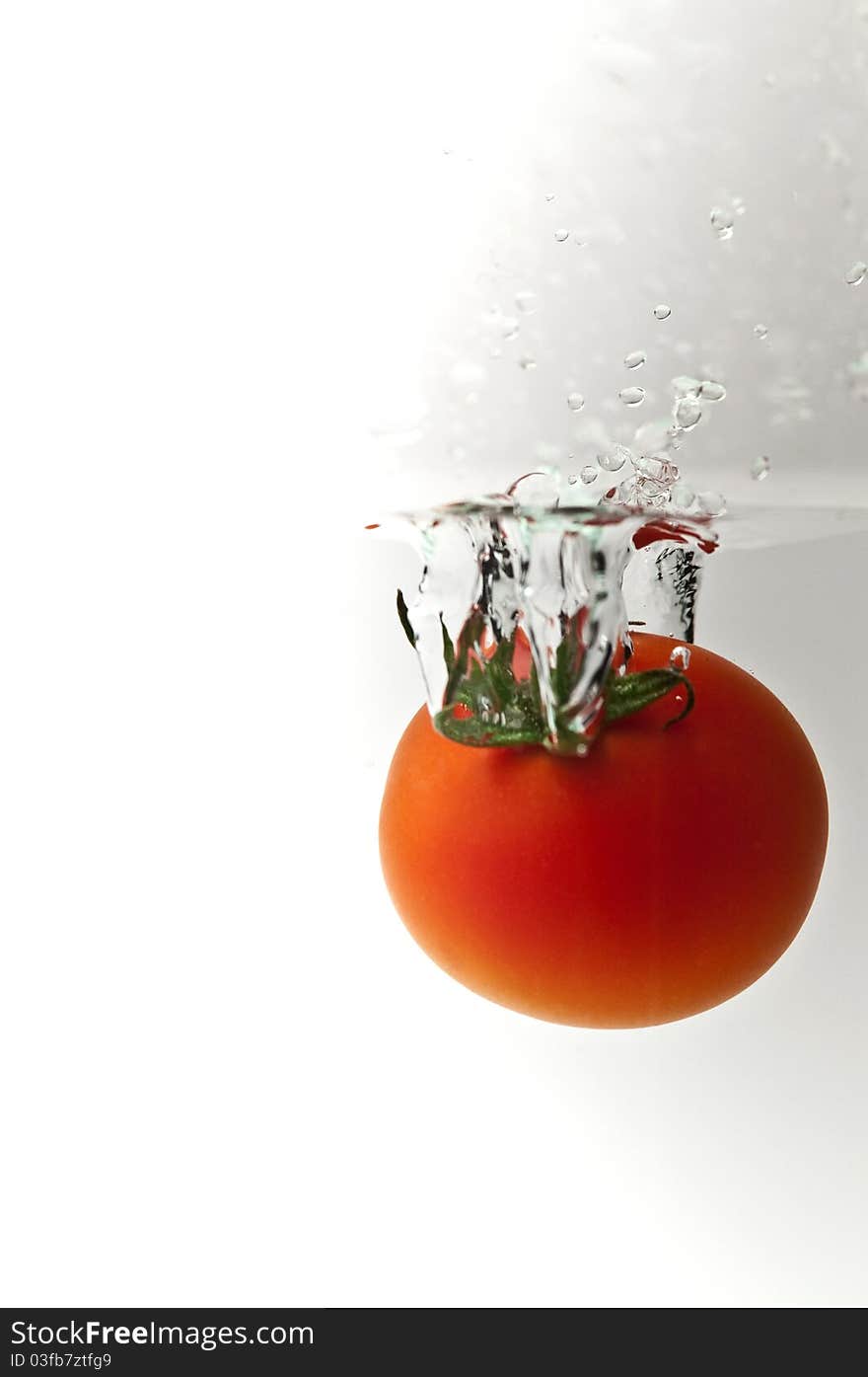 Red tomatoes on a white background