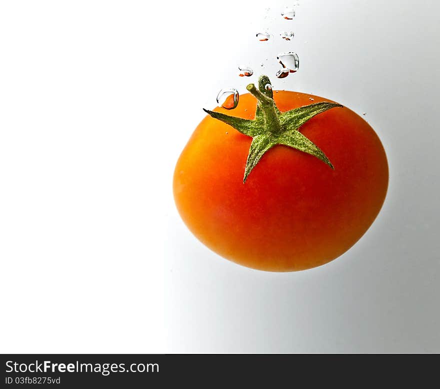 Red tomatoes on a white background