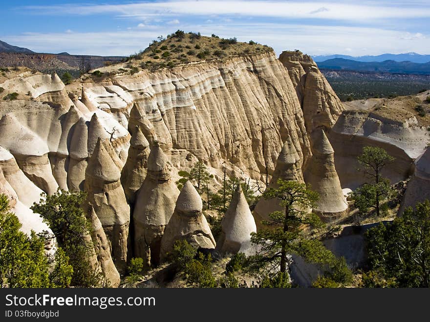 Desert mountains and spire with blue skies. Desert mountains and spire with blue skies.