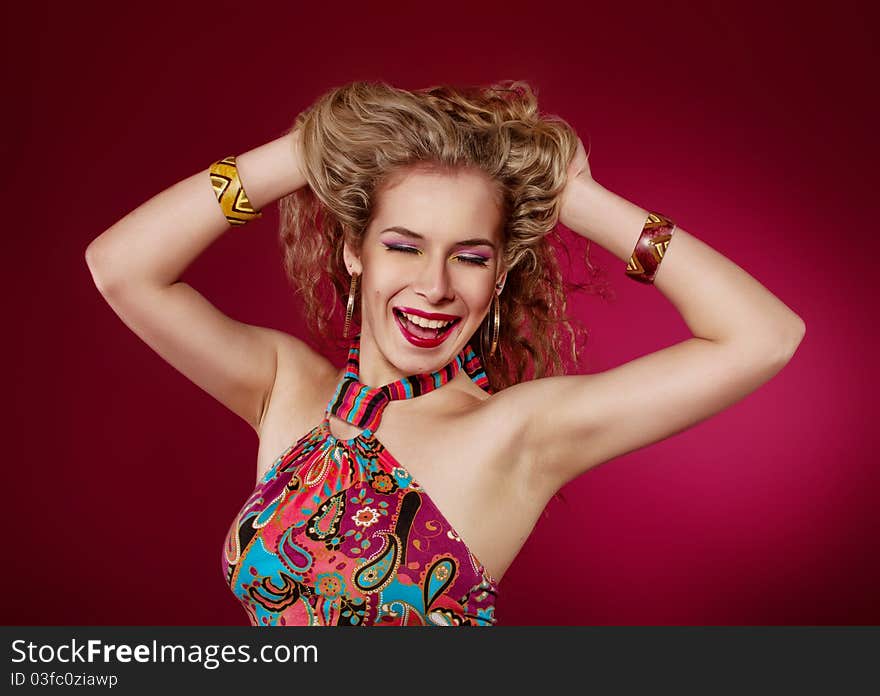 Emotional portrait of the young woman on a red background. Emotional portrait of the young woman on a red background