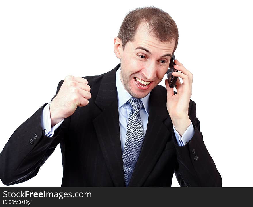 Angry businessman is speaking on the phone