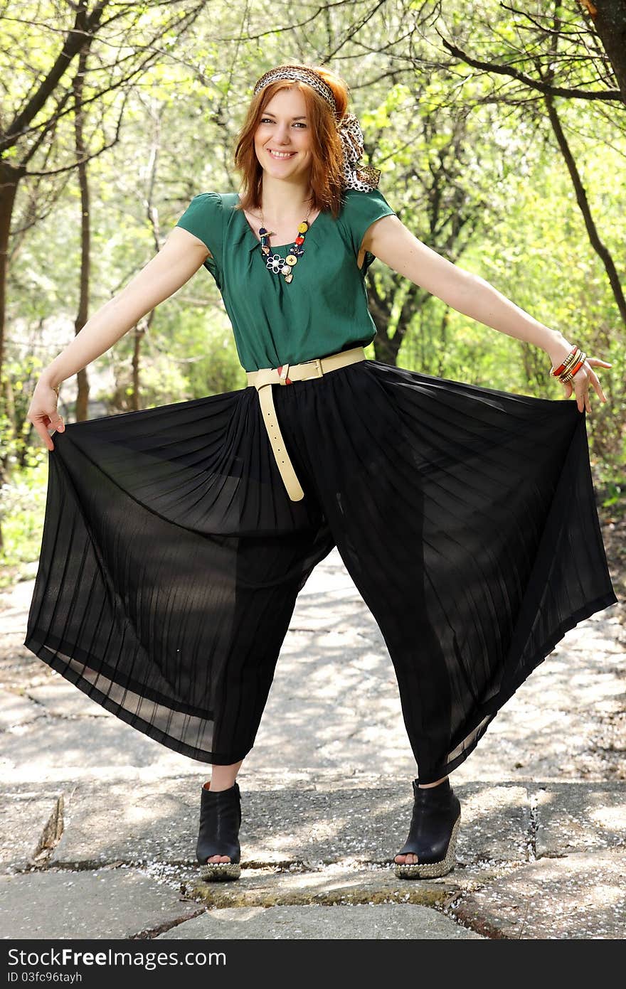 A beautiful red hair woman showing her crop pants. A beautiful red hair woman showing her crop pants.