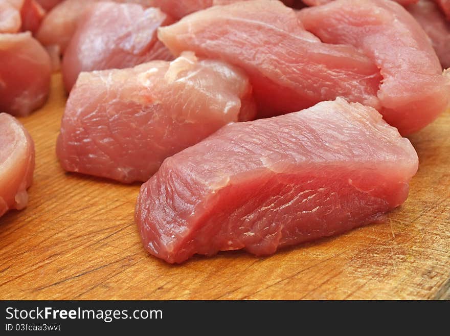 Raw meat on a wooden board