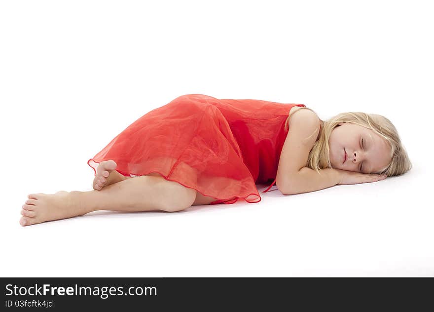 Little girl sleeping in a red dress on a white background. Little girl sleeping in a red dress on a white background.