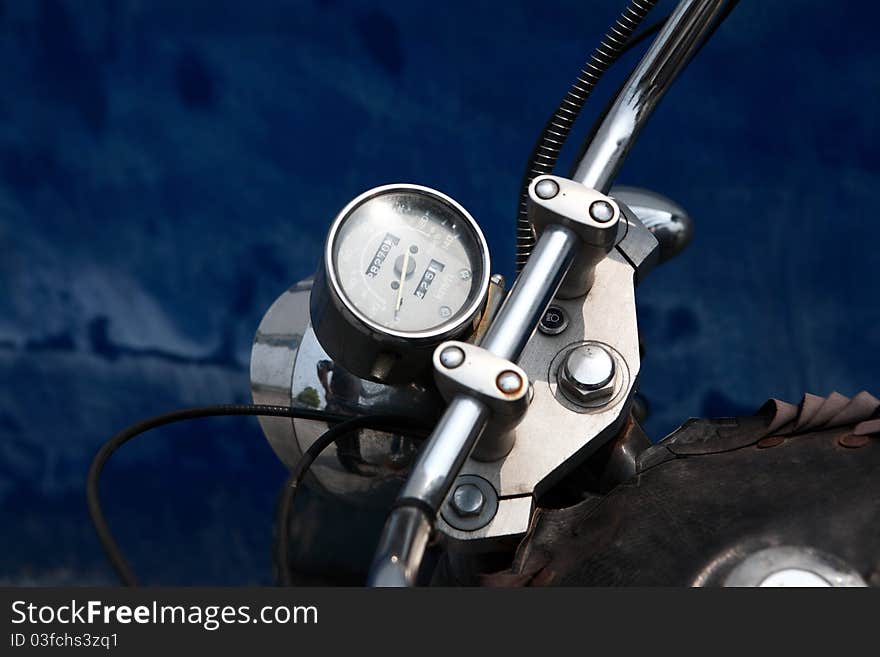 Close up of Tachometer of motorcycle with blue background. Close up of Tachometer of motorcycle with blue background