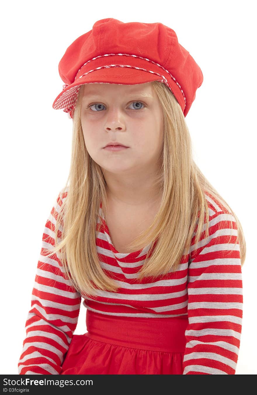 Little girl in red hat and dress looking worried and unhappy. On white background. Little girl in red hat and dress looking worried and unhappy. On white background.