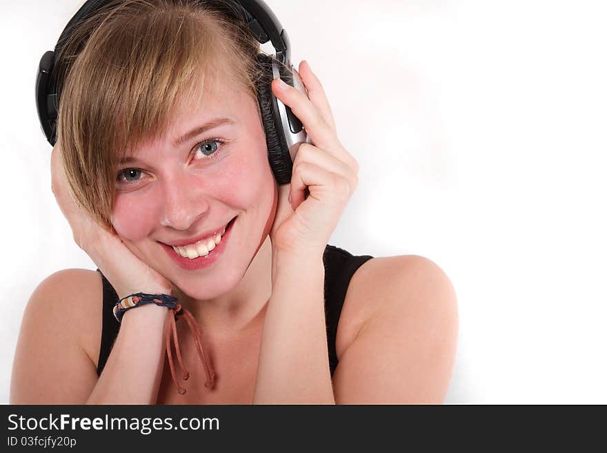 Young girl in DJ stereo headset smiling. Young girl in DJ stereo headset smiling