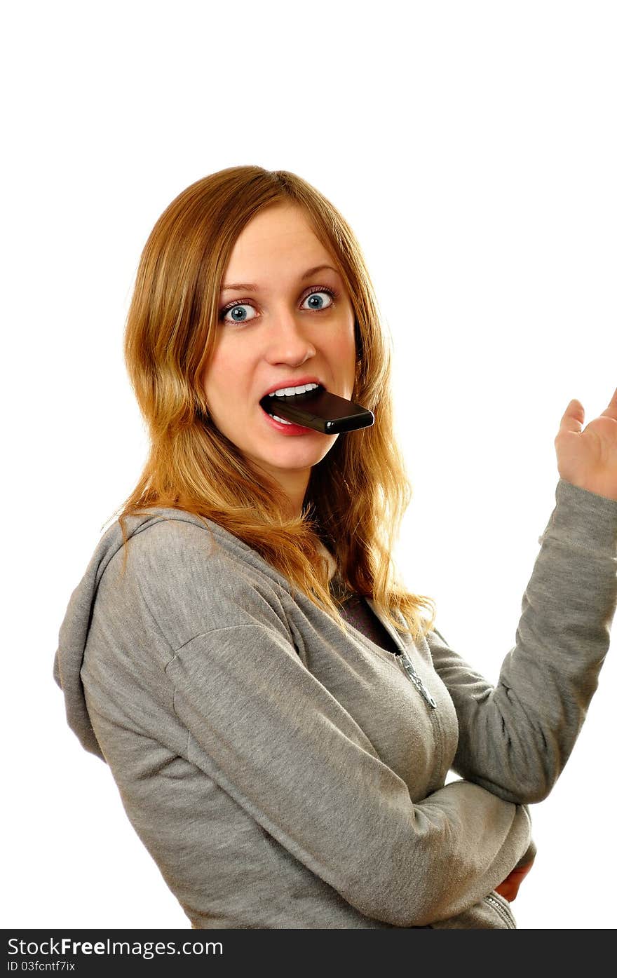 Woman holding mobile phone in mouth. Woman holding mobile phone in mouth