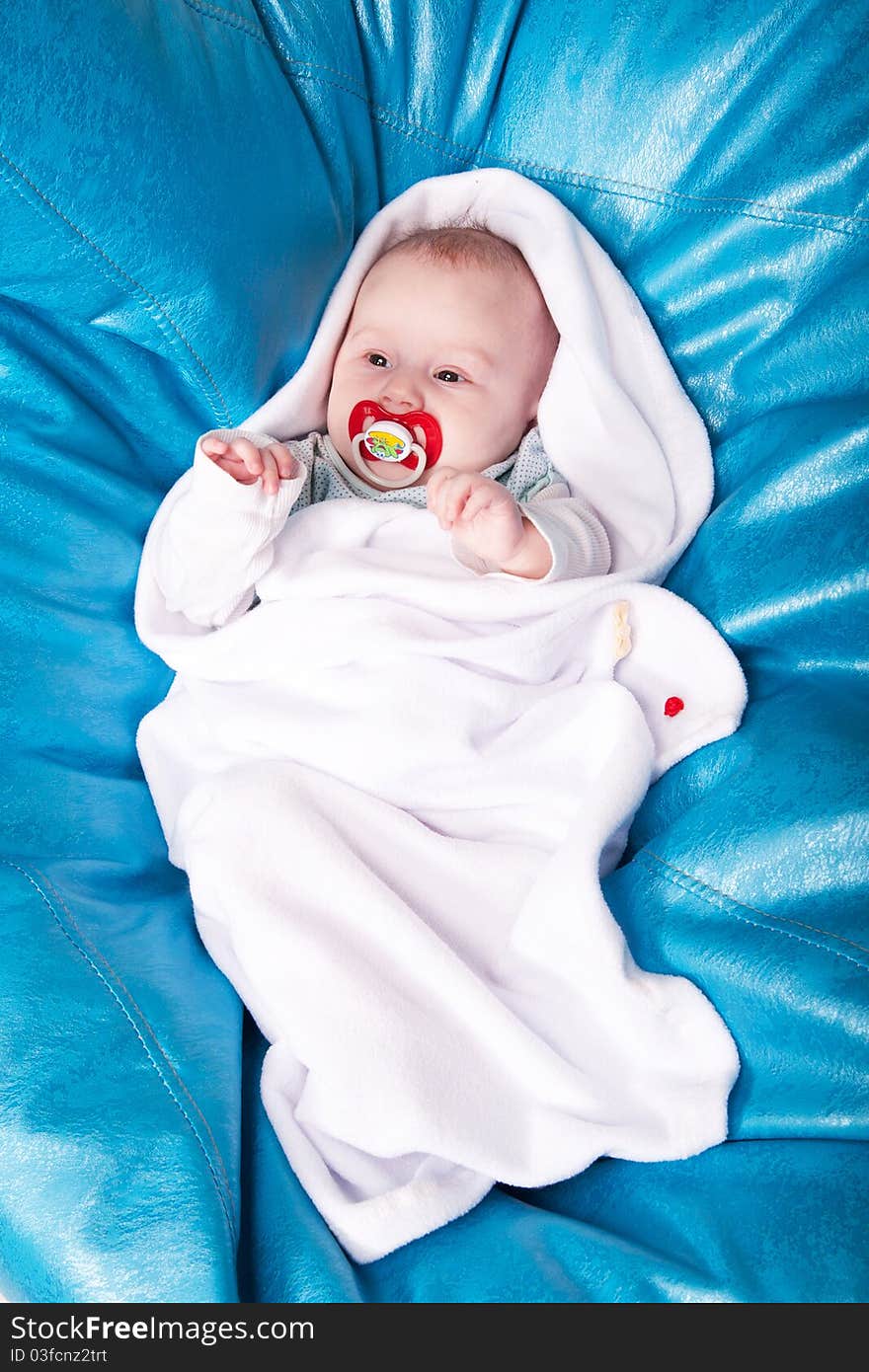 baby wrapped up in the white swaddling band