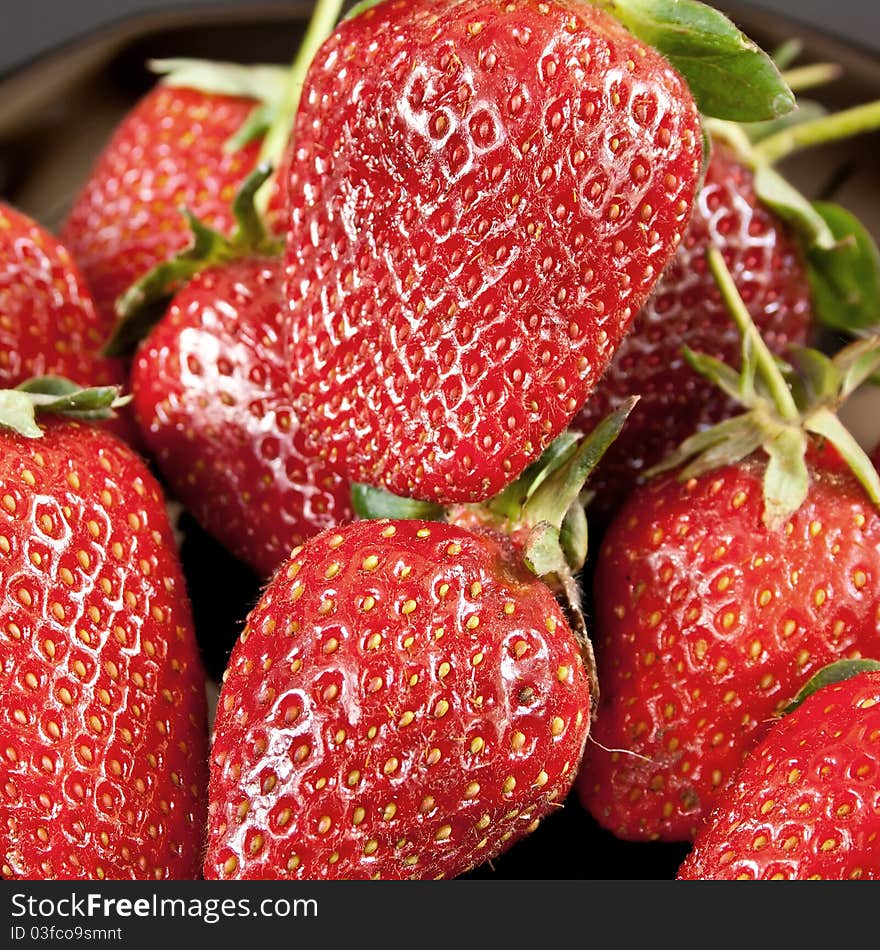 Fresh strawberries close up background. Fresh strawberries close up background