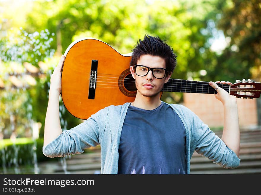 Young man playing a guitar. Young man playing a guitar