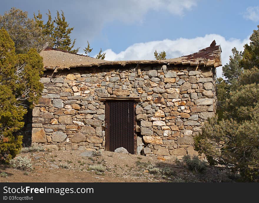 A photograph of an old mine shaft entrance.