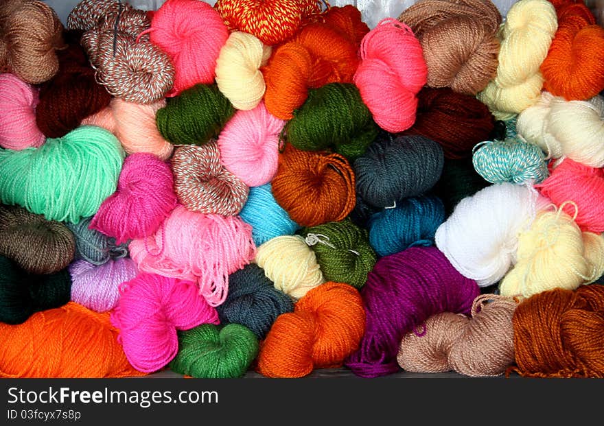 Colourful woollen balls used to create winter wear. Colourful woollen balls used to create winter wear