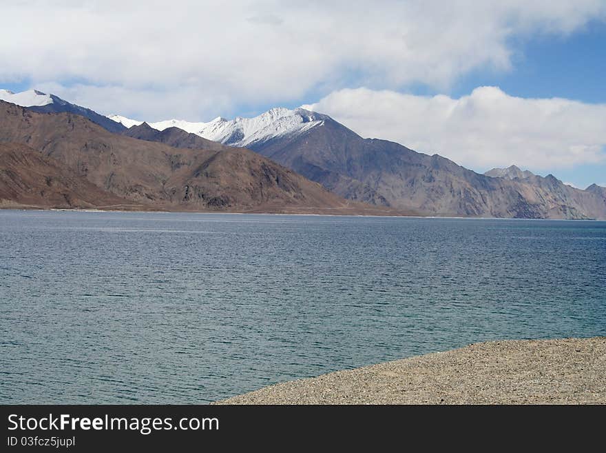 Beautiful serene blue lake in front of Snow clad mountains. Beautiful serene blue lake in front of Snow clad mountains