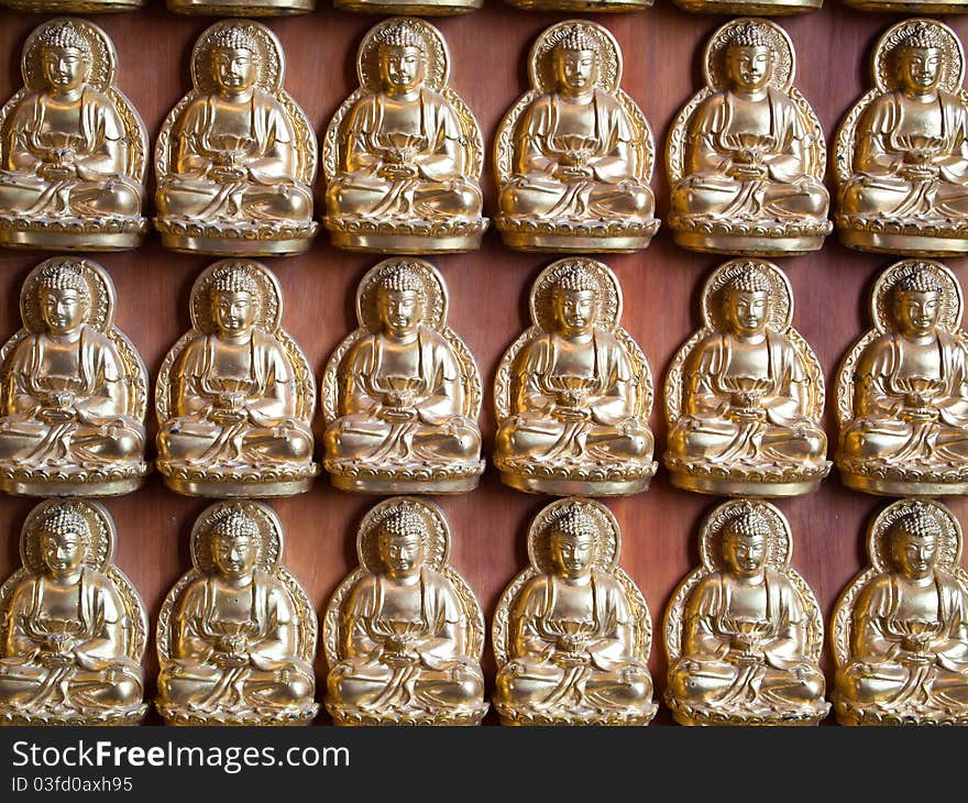 Many small Buddha statue on the wall at chinese temple in Thailand. Many small Buddha statue on the wall at chinese temple in Thailand