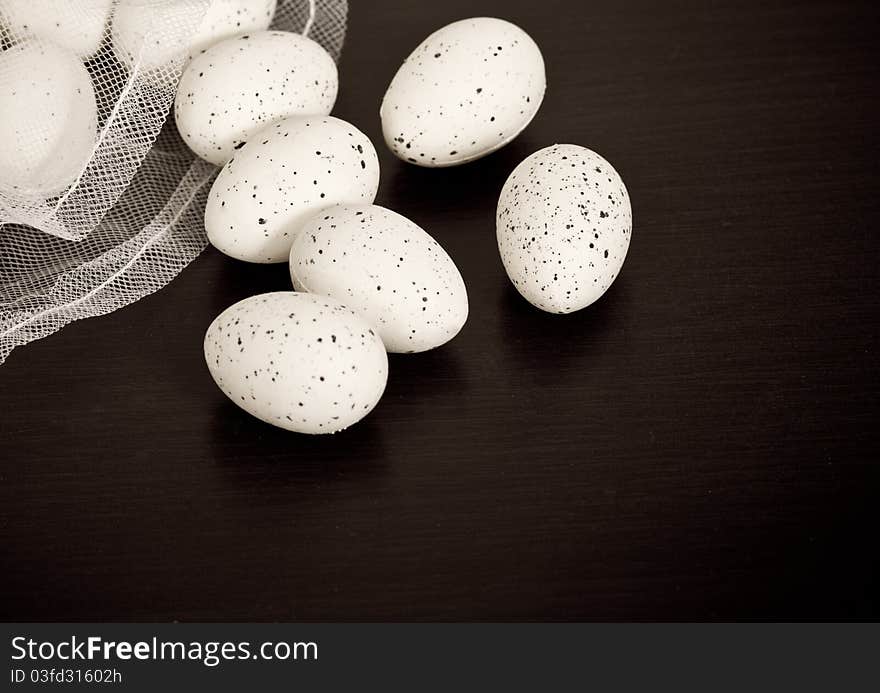 Quail eggs with black background