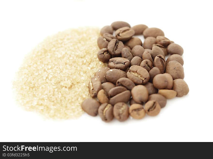 Sugar and coffee beans isolated on a white background. Sugar and coffee beans isolated on a white background