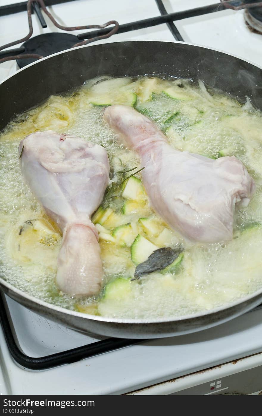 Chicken fried with zucchini and onions