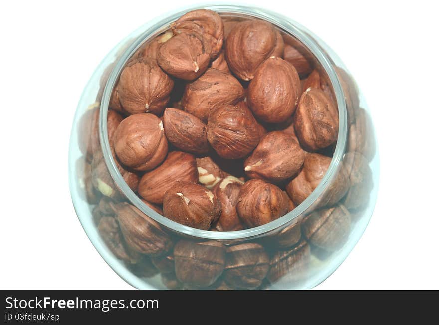 Glass bowl with hazelnuts