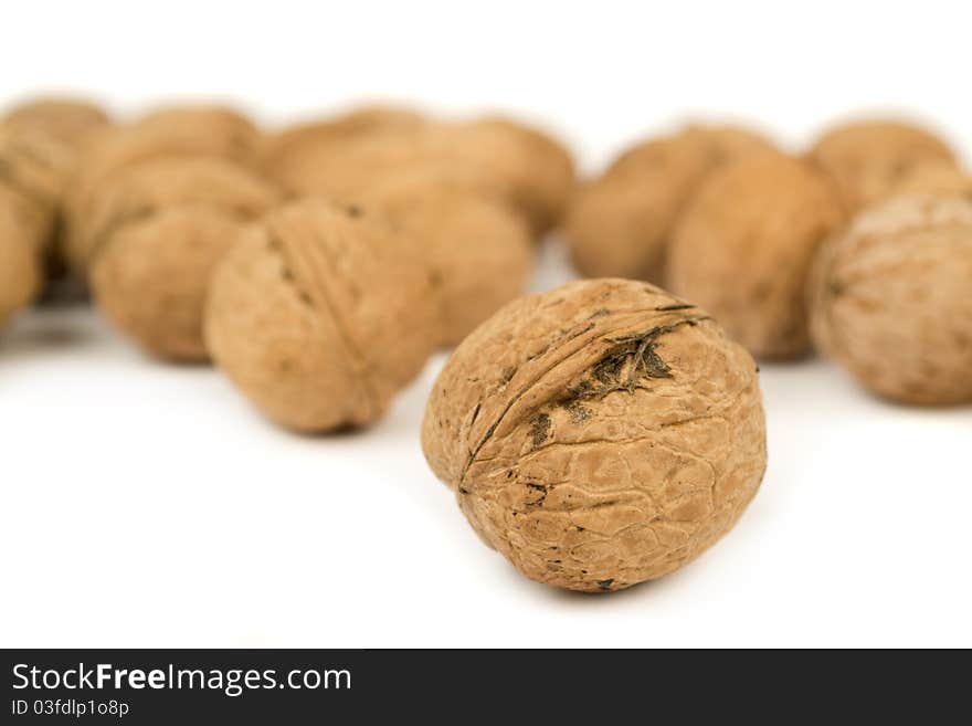 Some walnuts isolated on white