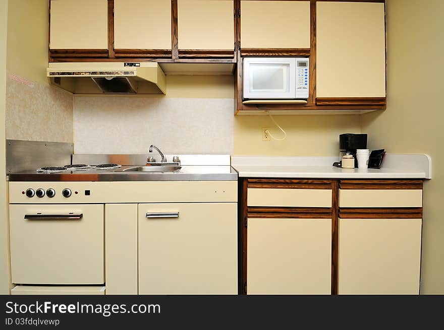 Generic kitchen layout view with cupboards and cooking stove.