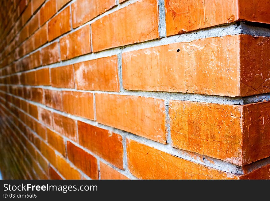 Close-up details of a orange-brown brick wall. Close-up details of a orange-brown brick wall.