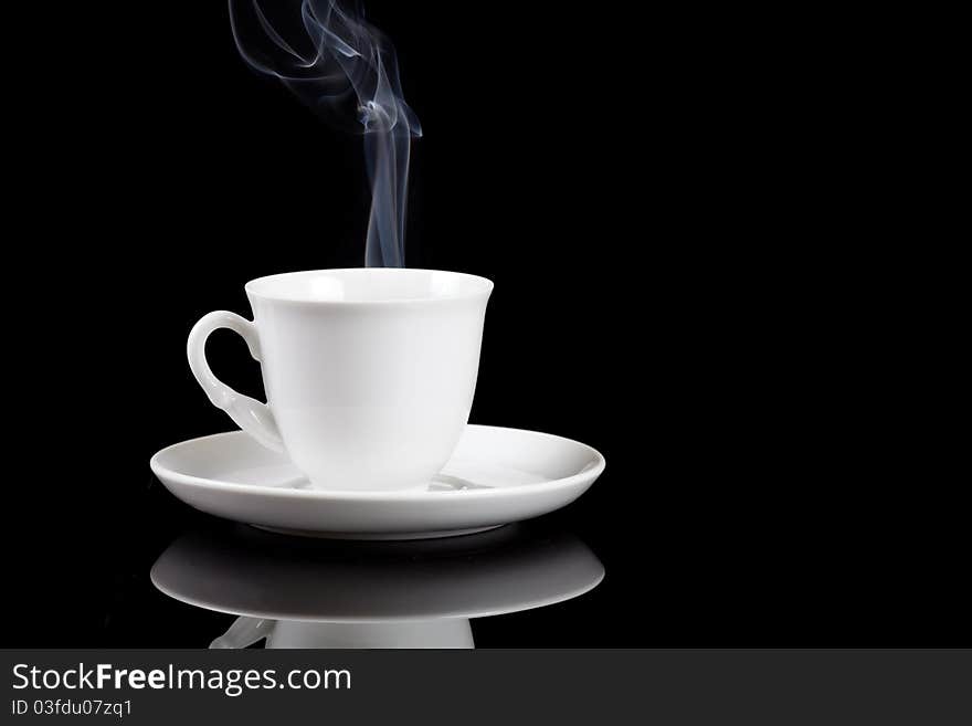 Hot coffee cup with reflection on black background