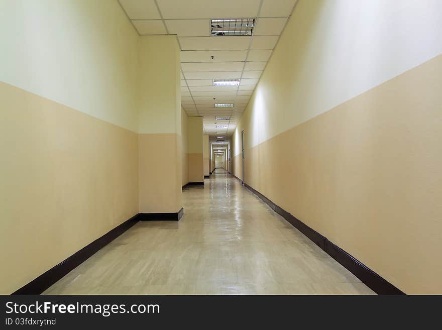 Very long corridor in the building. Very long corridor in the building