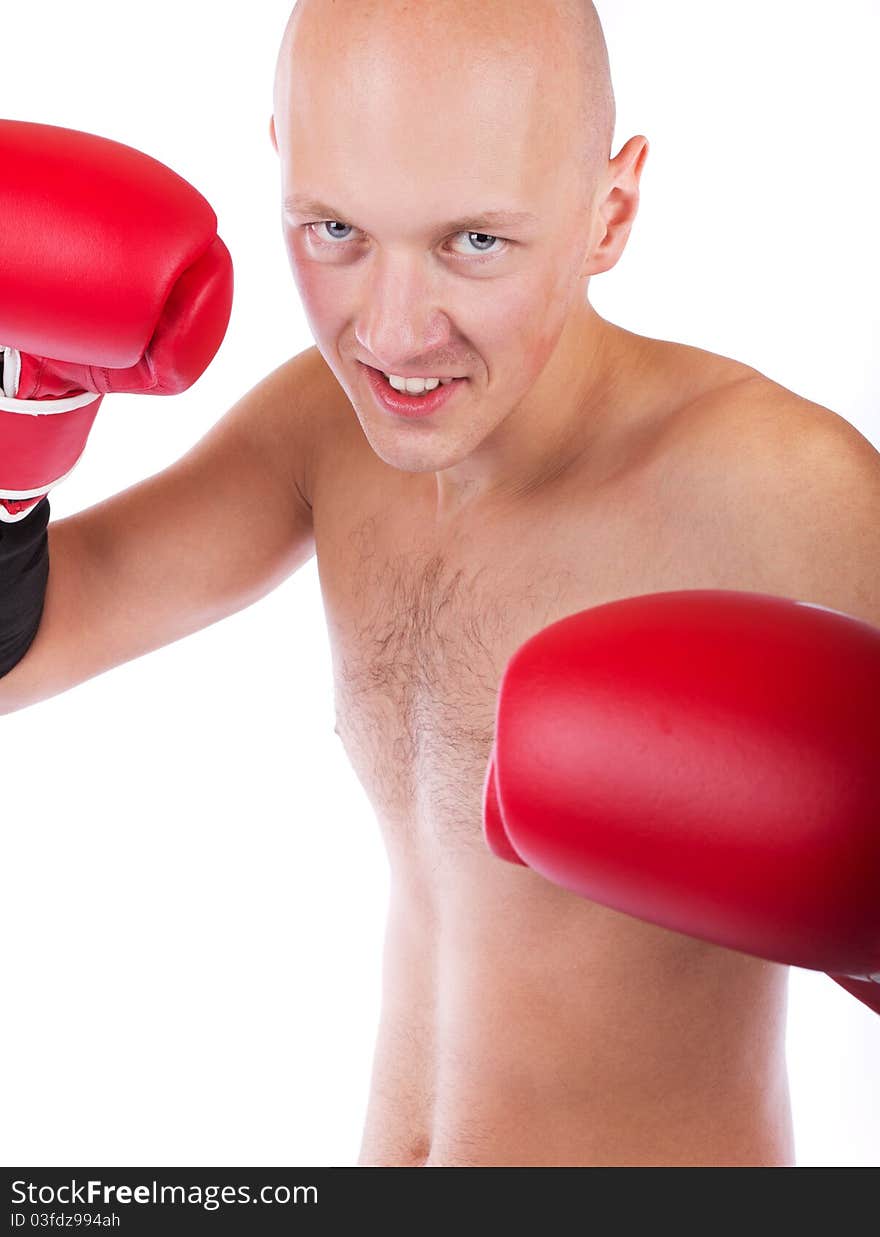 Bold boxer during fight in red gloves. Bold boxer during fight in red gloves