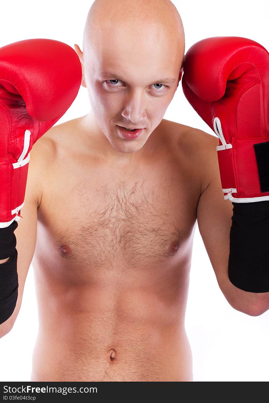 Young man wearing red boxing gloves. Young man wearing red boxing gloves