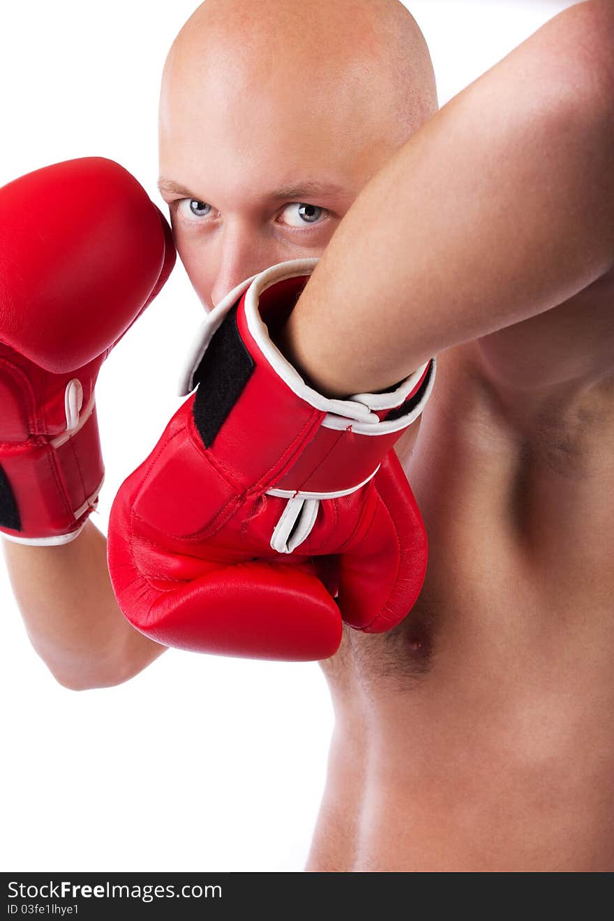 Bold boxer wearing red gloves and fightening. Bold boxer wearing red gloves and fightening