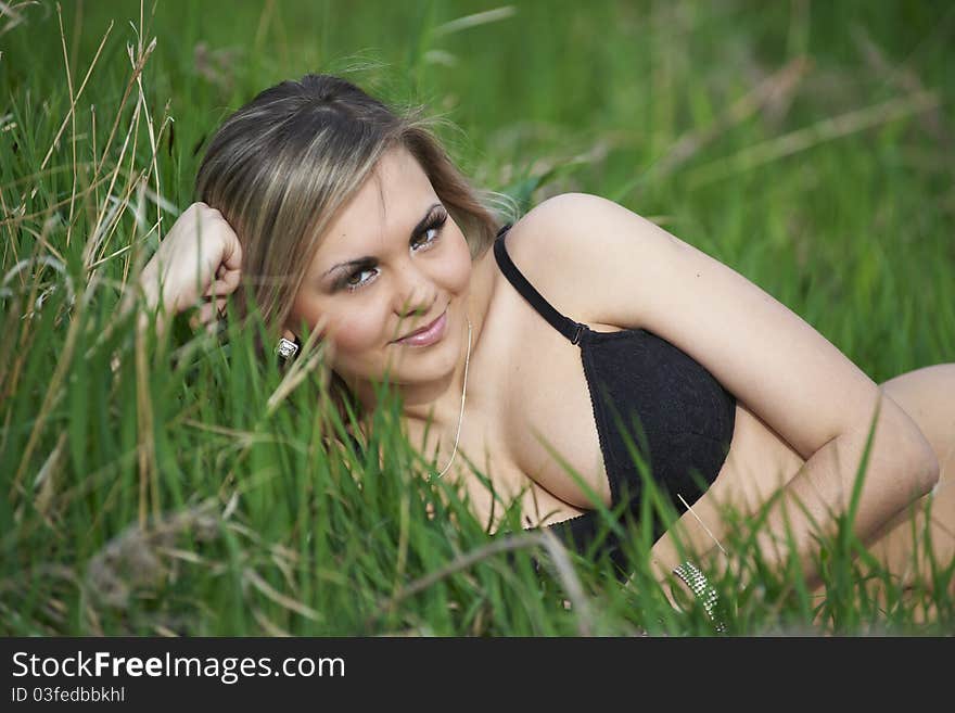 Ukrainian sexy girl in green grass