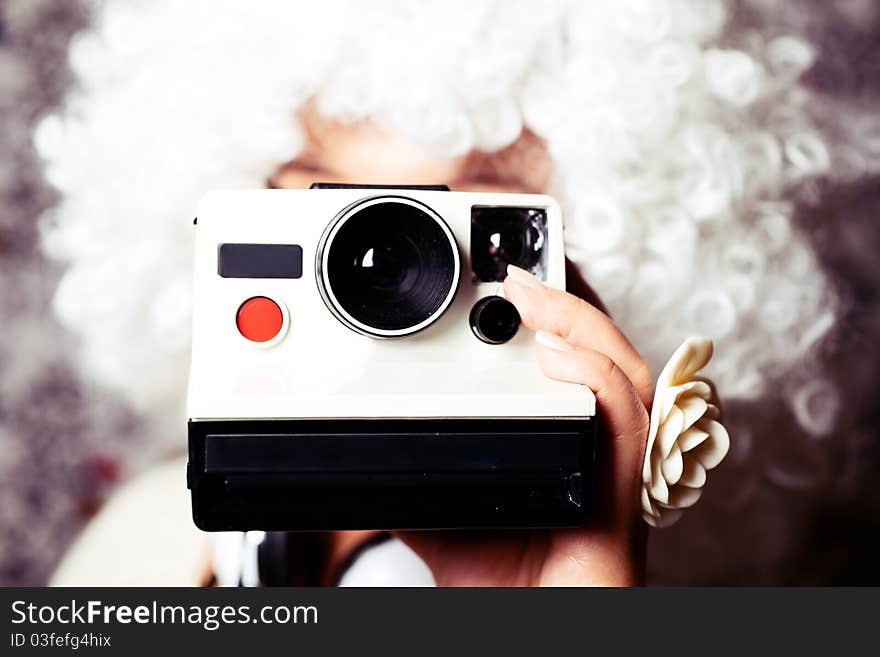 Young girl holding a camera. Young girl holding a camera.