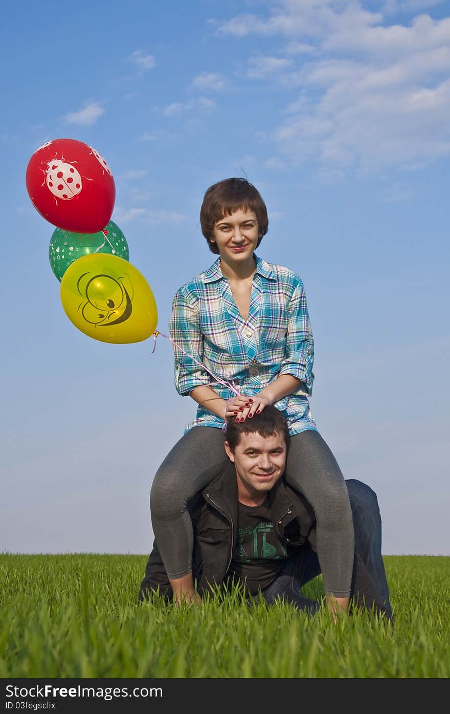 Young love Couple smiling with baloons