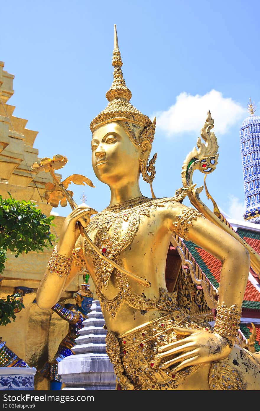 A Golden Kinnari statue at Wat Phra Kaew , Bangkok, Thailand. A Golden Kinnari statue at Wat Phra Kaew , Bangkok, Thailand