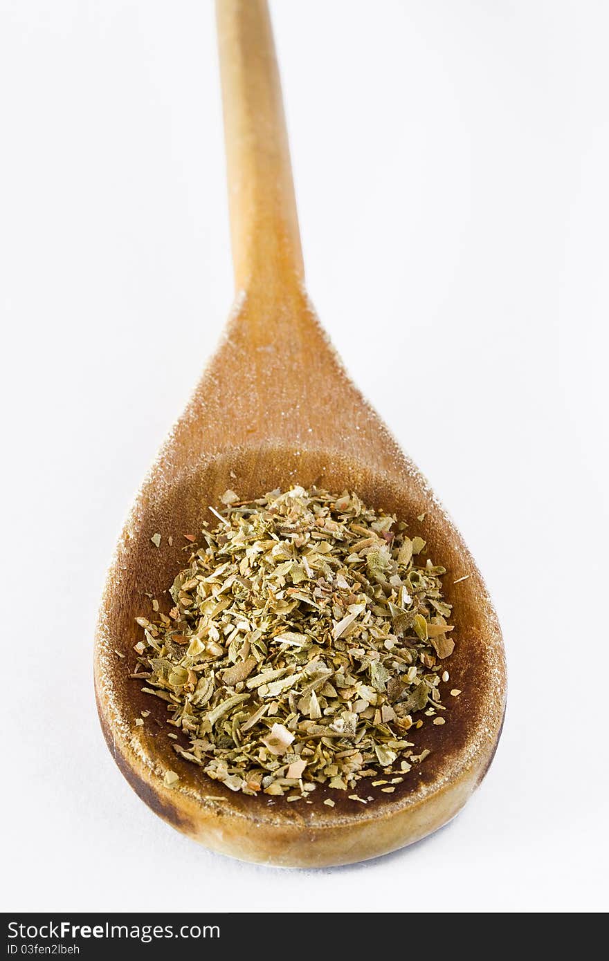 Oregano in wooden spoon