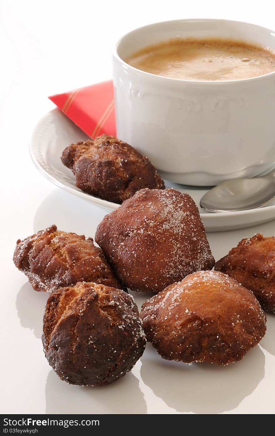 Traditional spanish fritters and a white coffee