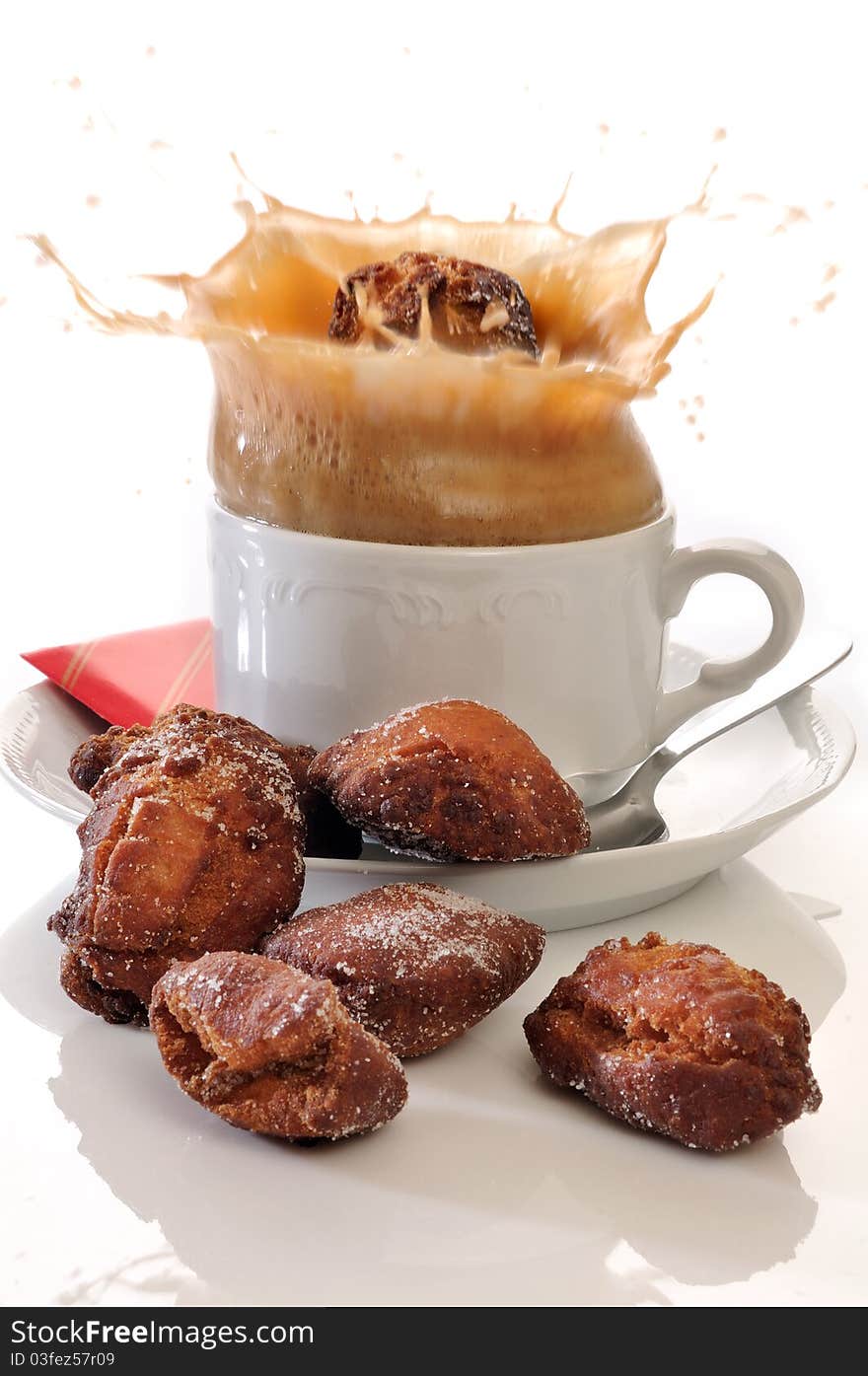 Traditional spanish fritters and a white coffee