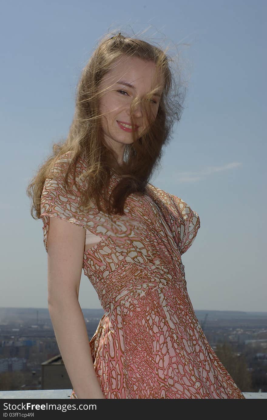 Girl with loose hair floating in the wind