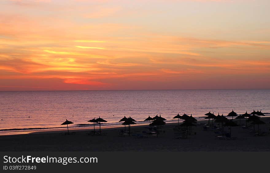 Sunrise on the beach in a beach resort in Tunesia