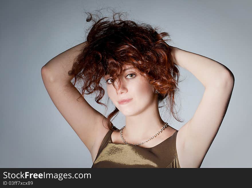 Red haired woman playing with haircut. Red haired woman playing with haircut