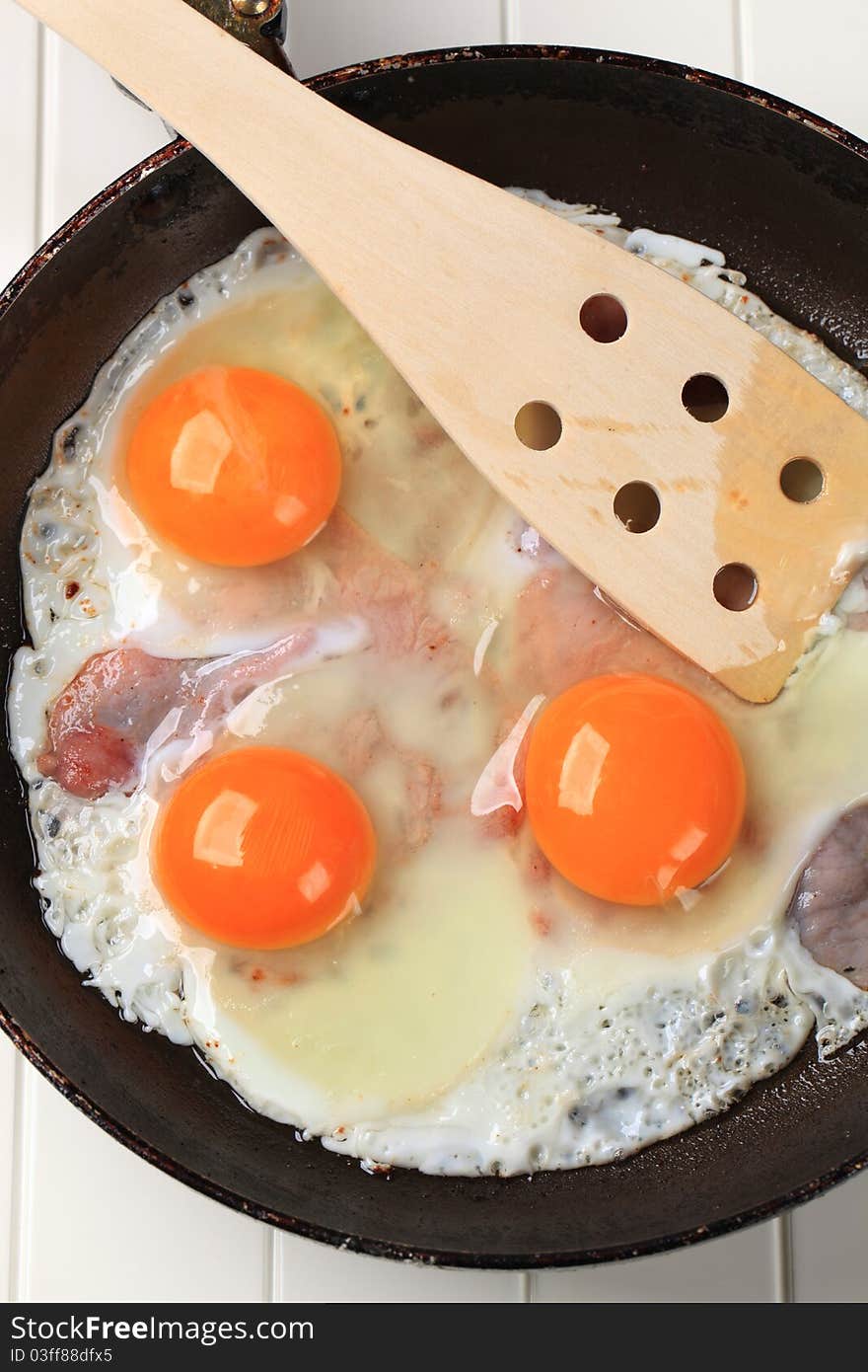 Preparing Ham And Eggs