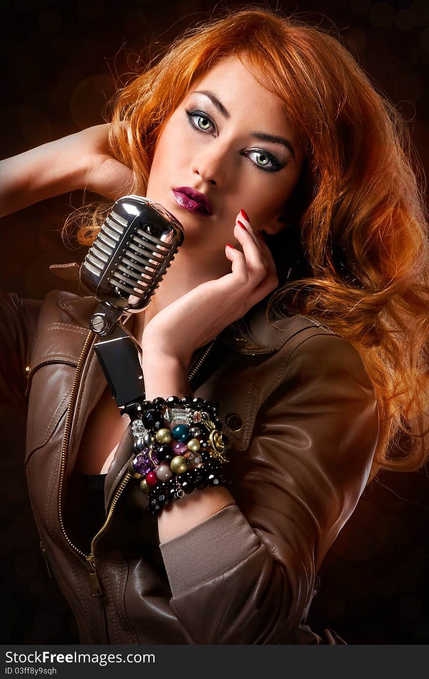 Beautiful redhead girl with retro microphone. Beautiful redhead girl with retro microphone